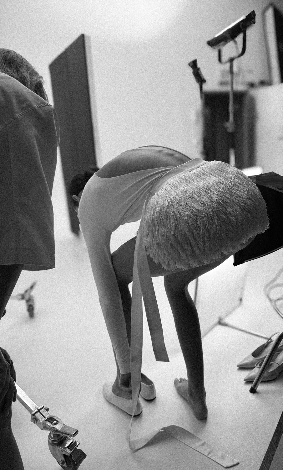 On set, a WOMANZE fringe piece between takes