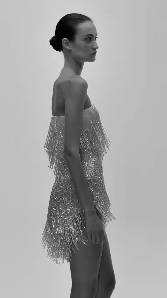A WOMANZE crystal fringe piece in movement