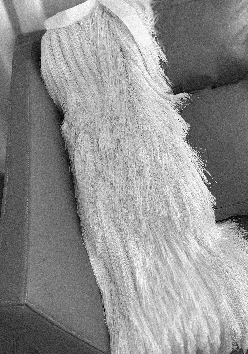A fringe dress resting after its making, WOMANZE atelier
